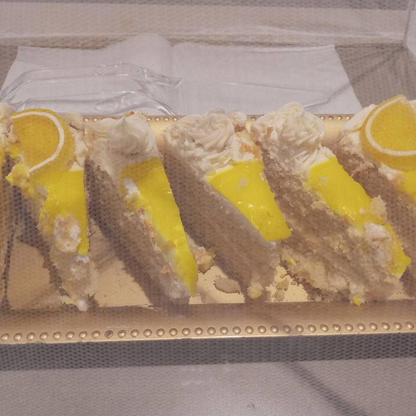 Lemon cake slices with lemon curd and a candied lemon