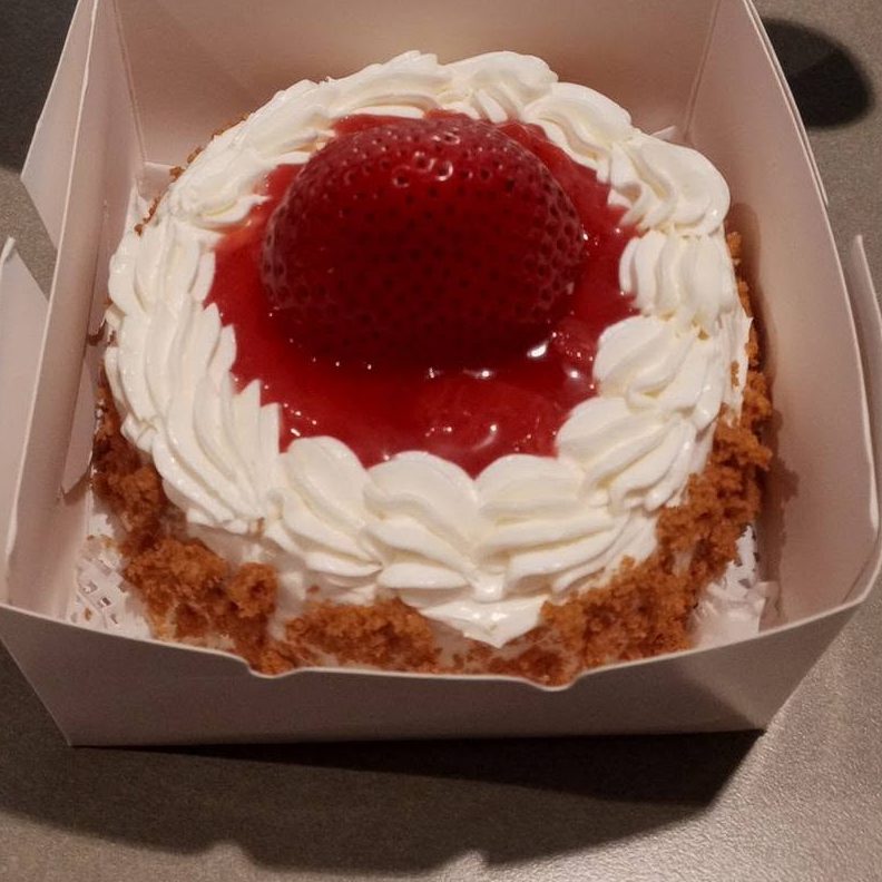 Strawberry shortcake with a glazed strawberry